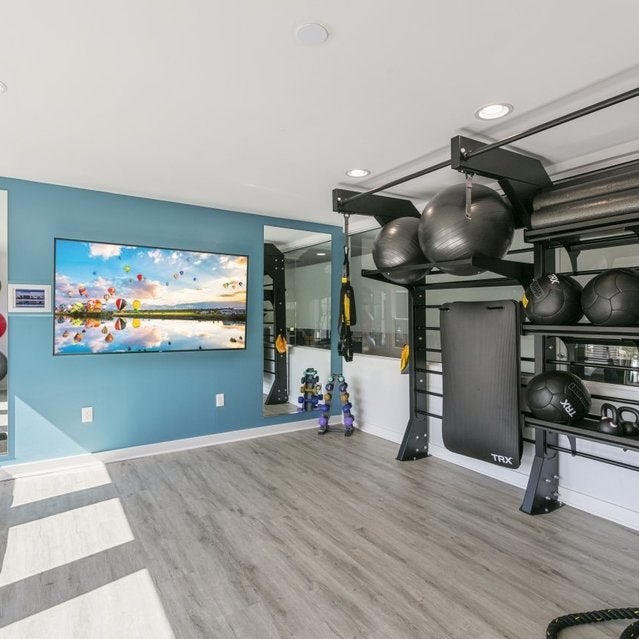 Andover at Crabtree Apartments - fitness center with medicine balls, TRX bands, kettlebells and more