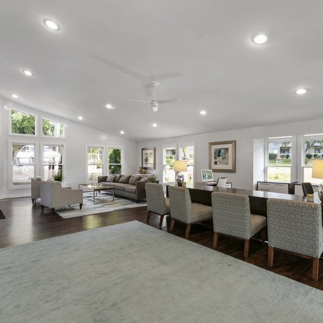 Andover at Crabtree Apartments - leasing center with desks and chairs
